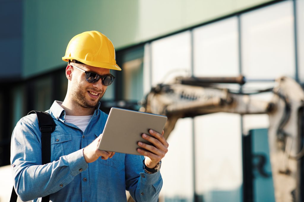 Construction inspector using digital tablet on the construction site